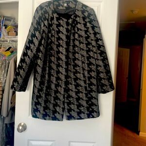 Overcoat.  Knee length. Very stylish.